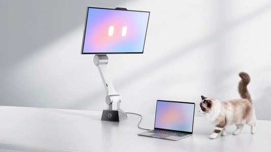 CyboPal ONE robotic monitor beside a laptop